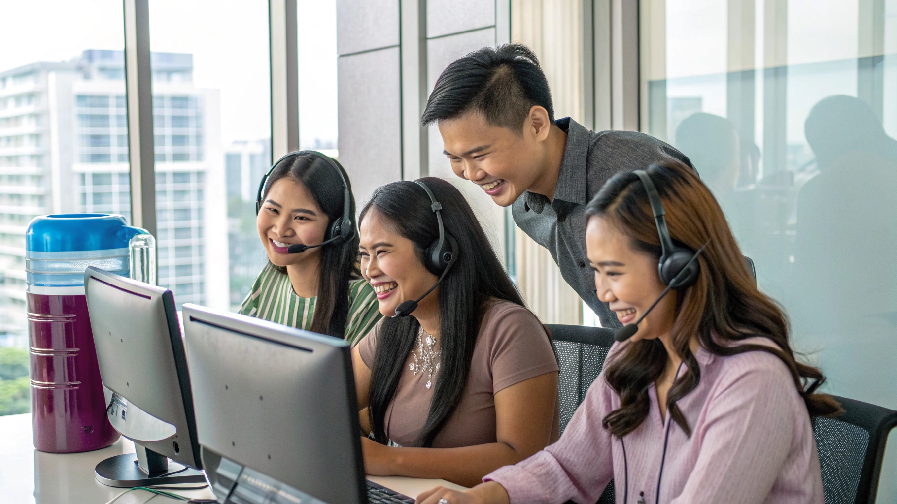 Haitel BPO agents with headsets conducting outbound telemarketing campaigns